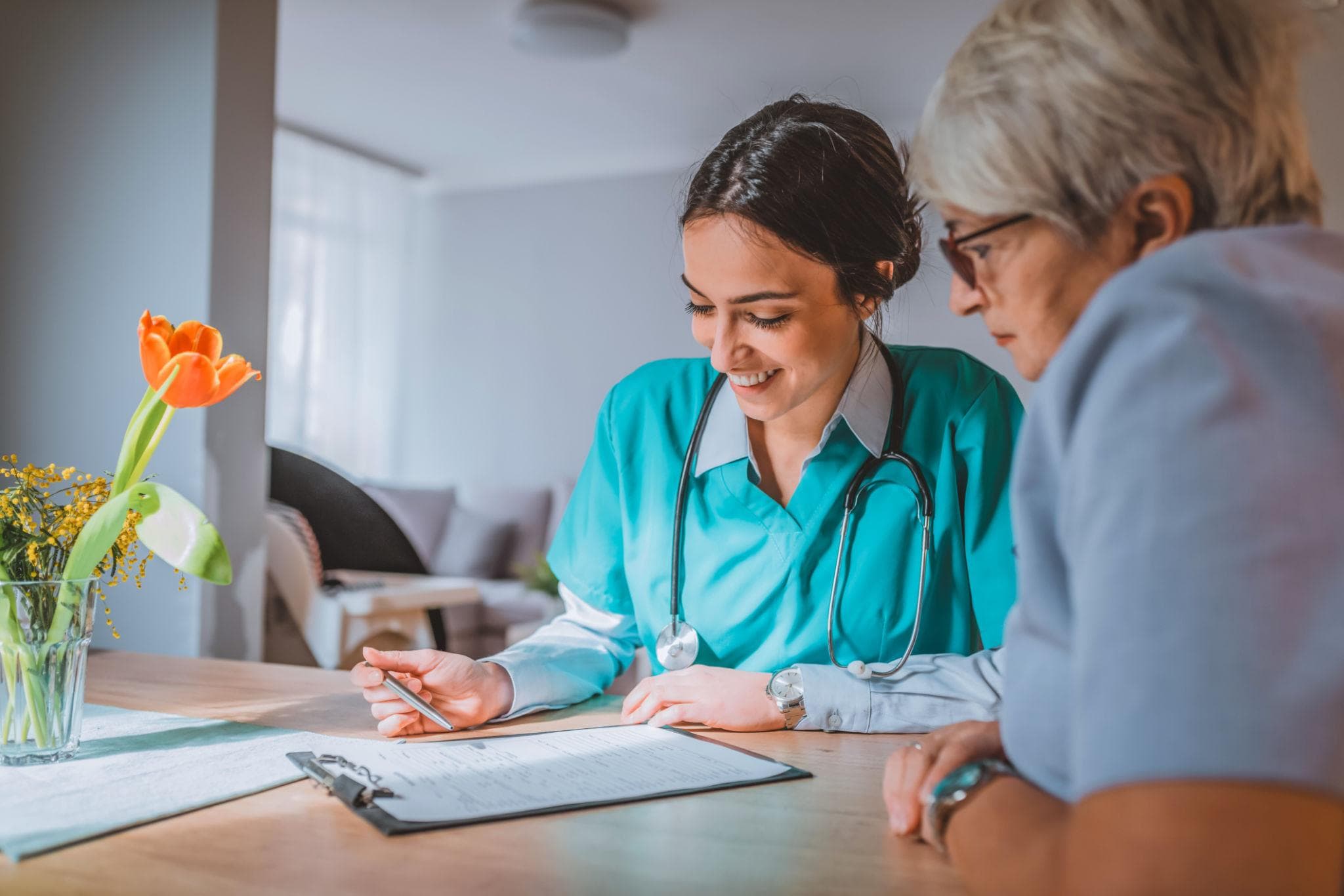 Care professional completing a values-based assessment