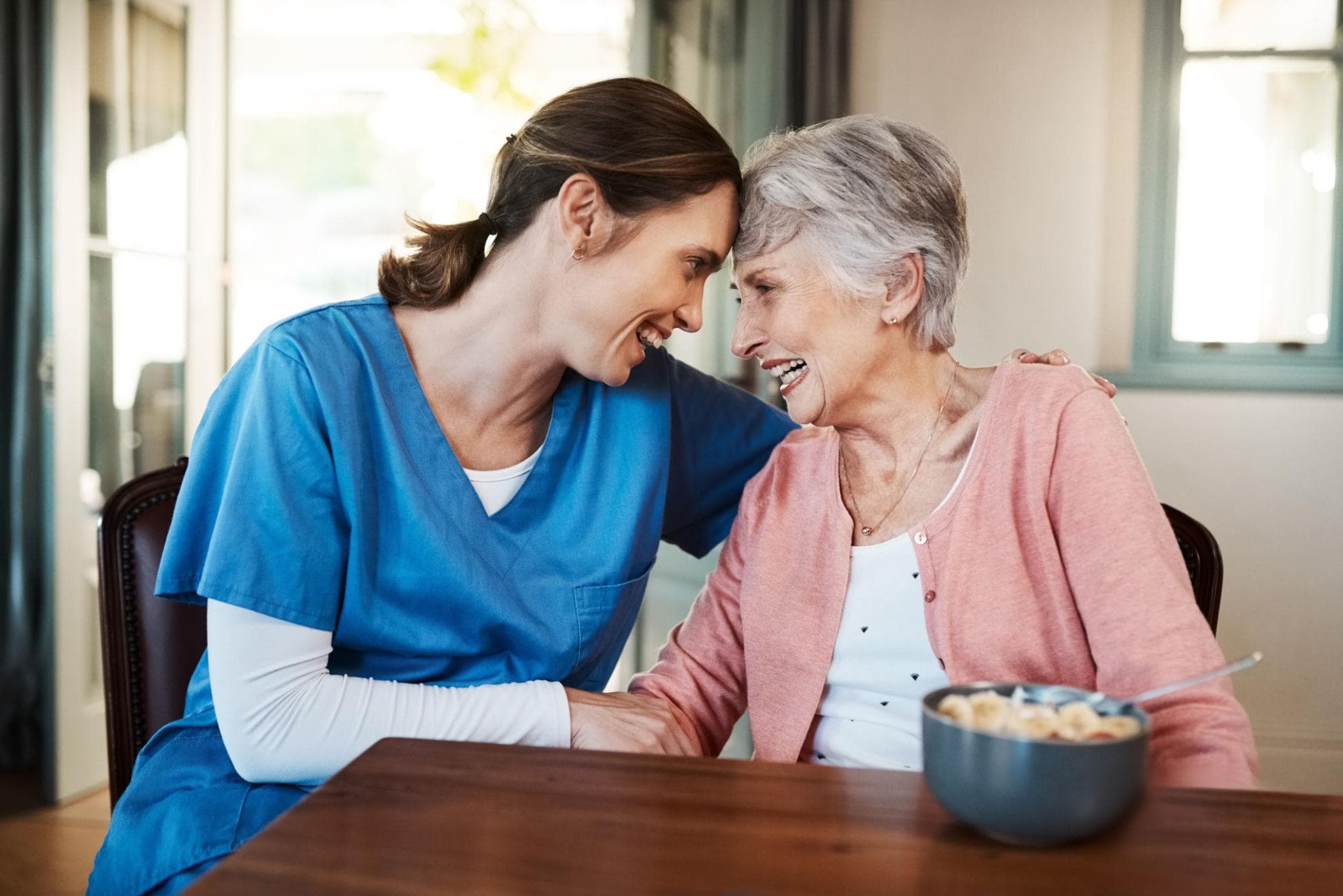 Compassionate, trained care worker supporting an elderly client
